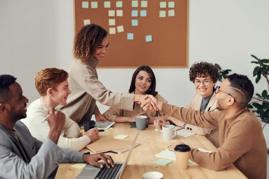 Team planning a product release around a table