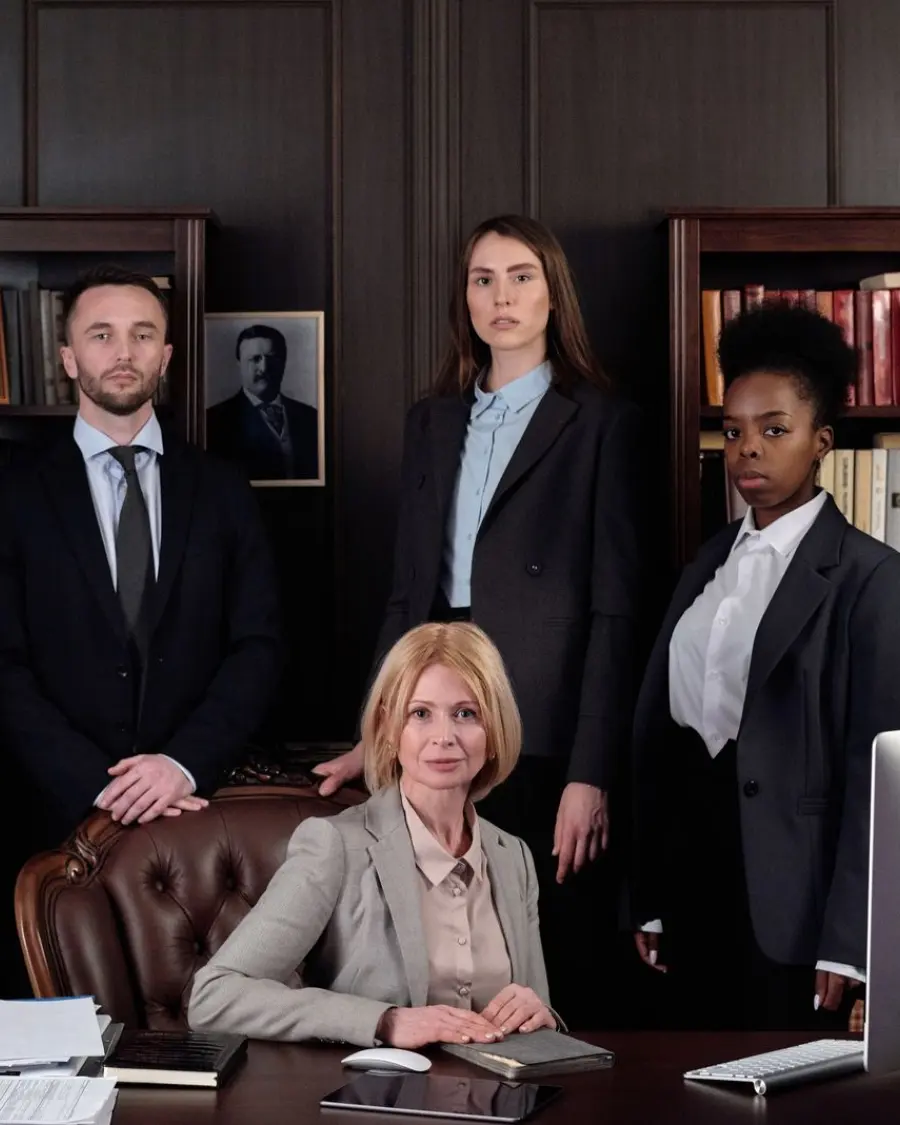 The attorneys of the firm standing together in the offices