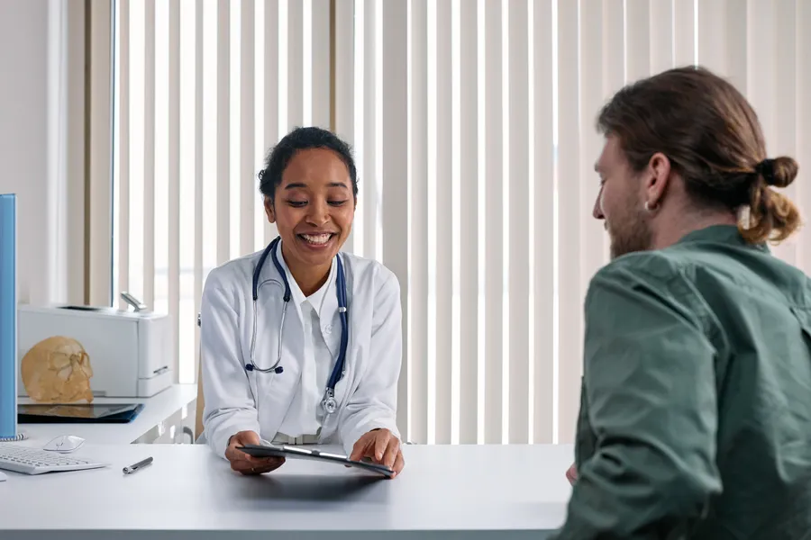 Surgeon reviewing a plan with a patient