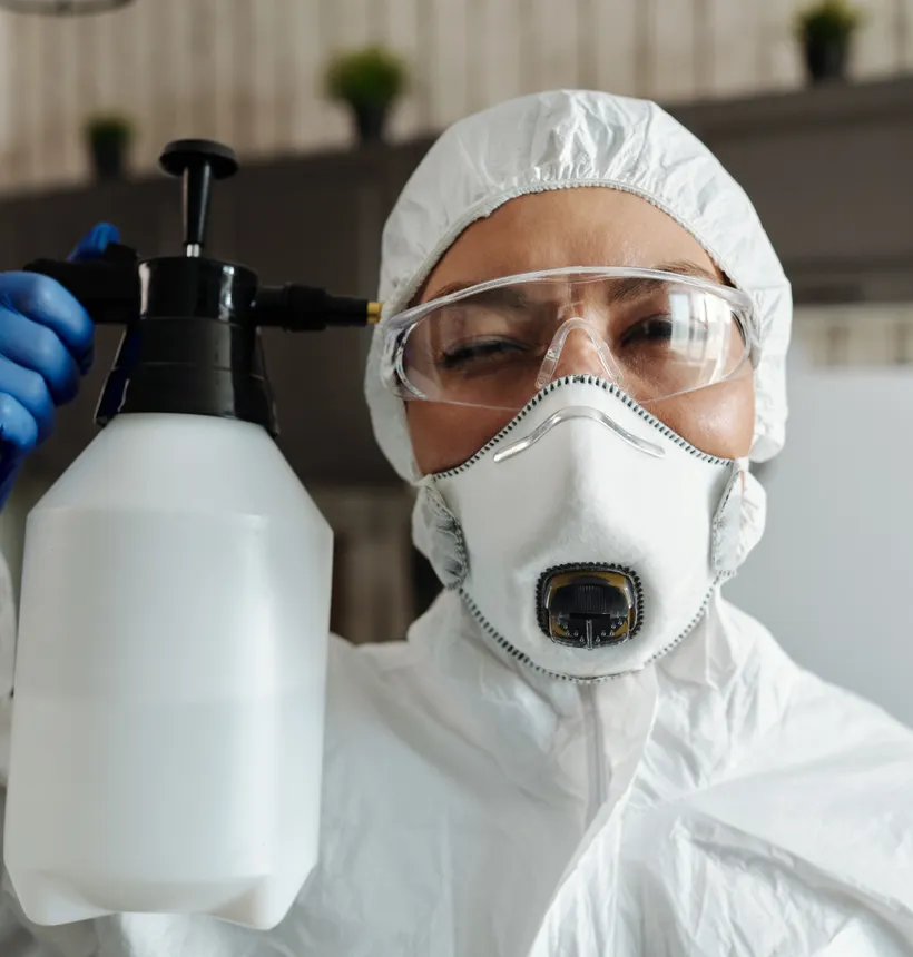 Certified technician in protective equipment during an indoor service visit